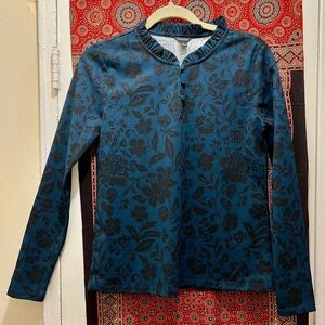 Size small Ann Taylor blue and black floral printed long sleeved blouse.